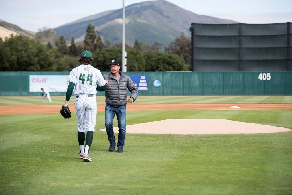 Erik Justesen Chair of FHMC Foundation Board throws out first pitch