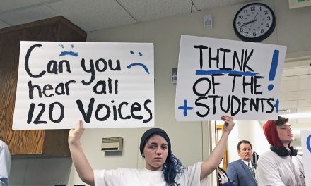 Emotions Run High as School Board Cuts Programs and Employees
